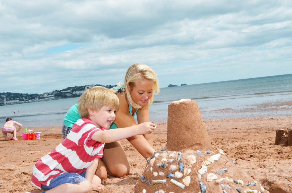 Goodrington Beach. Family Friendly Beaches building sandcastle