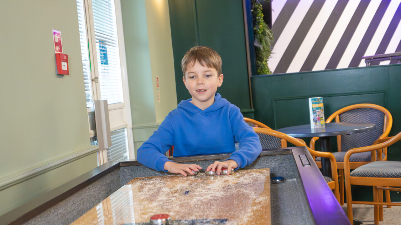 Playing Shuffleboard at Saltwater Kitchen, Terrace & Bar