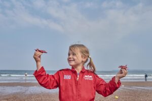 Child in Red Arrows Flight Suit at English Riviera Airshow