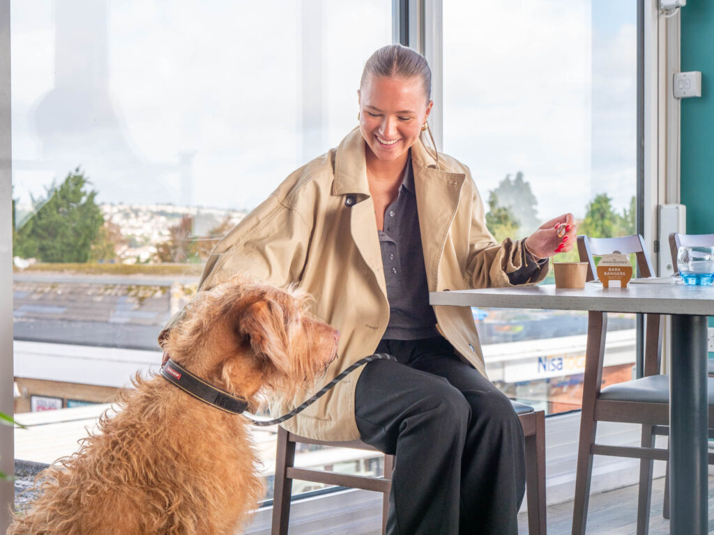 Dog and owner at The Jetty Restaurant at Beverley Holidays
