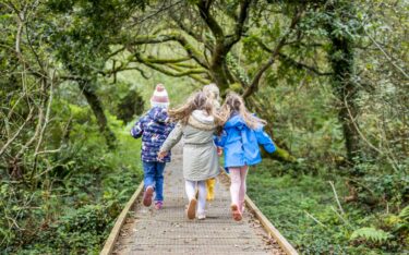 Kids walking in Autumn. Family Weekend.
