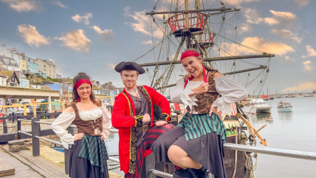 Starlight Stars dressed as Pirates in front of the Golden Hind